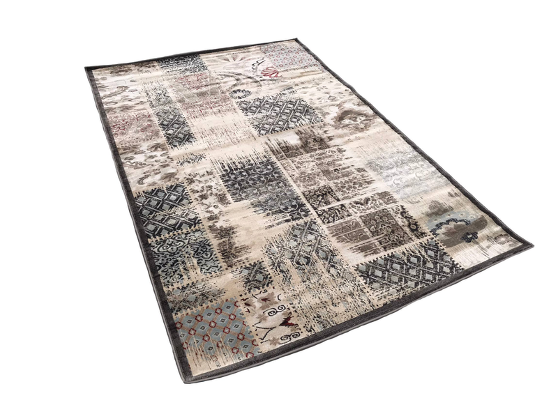 Beige ivory abstract area rug with black border and collage-style geometric patterns