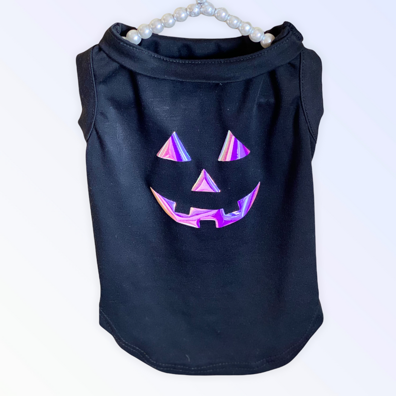 Black pet shirt with iridescent pumpkin jack-o'-lantern face applique