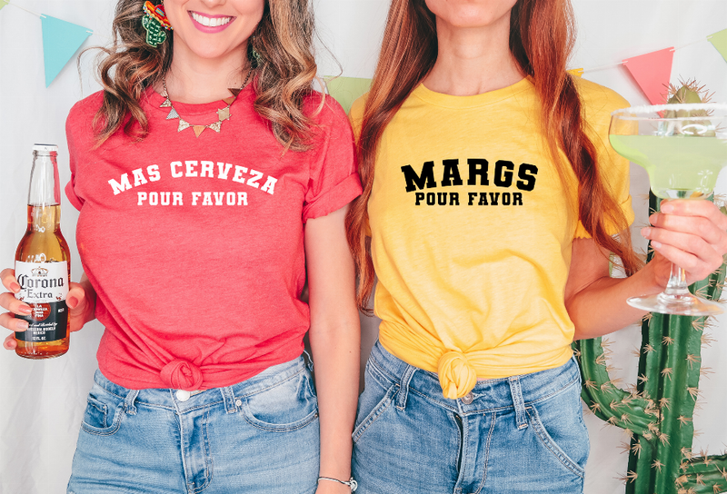 Two women’s graphic T-shirts in red and yellow with text, tied waist hem