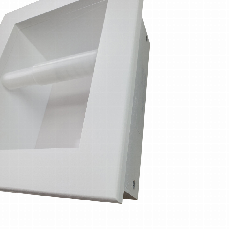 Close-up of recessed toilet paper holder edge in white with horizontal rod