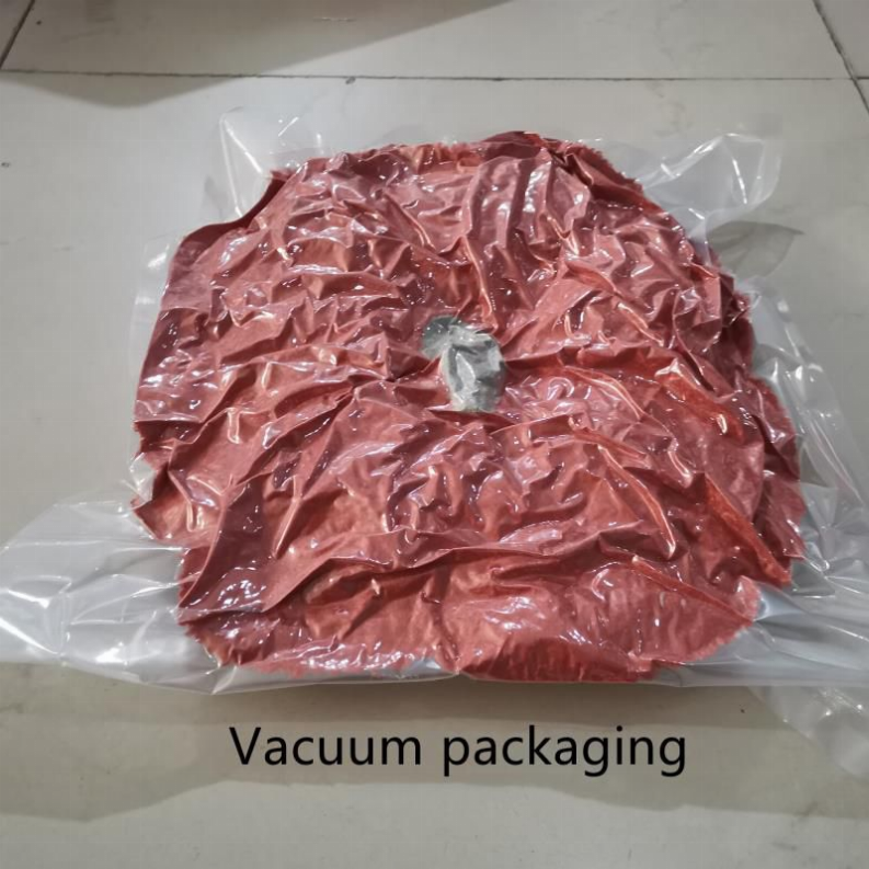 Vacuum-sealed pink pillow stuffing in a clear plastic bag