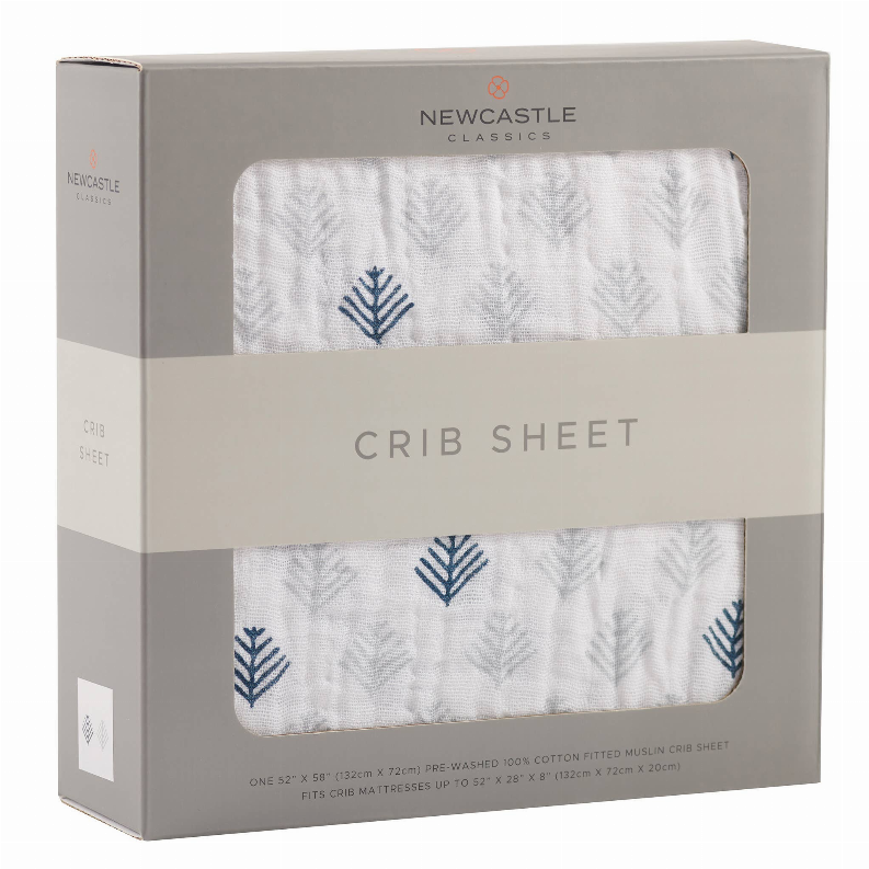 Gray crib sheet with blue leaf pattern, shown in retail box window