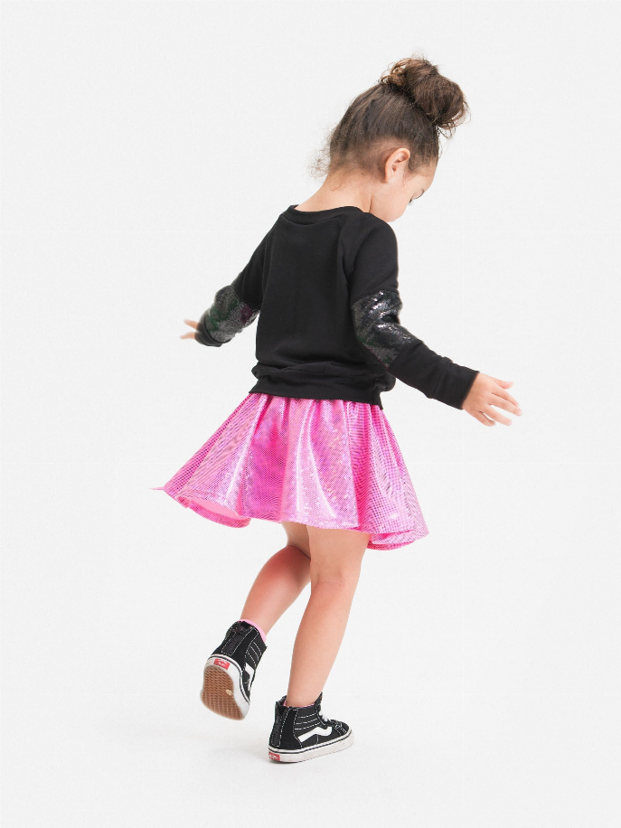 Black long-sleeve top with sequin accents, pink sequin skirt, and black high-top sneakers for kids.