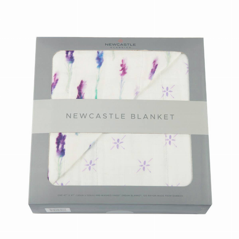 White lavender floral blanket with purple and blue sprig pattern, folded