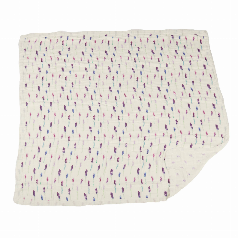 White blanket with repeating vertical purple sprig pattern and tiny flower bursts