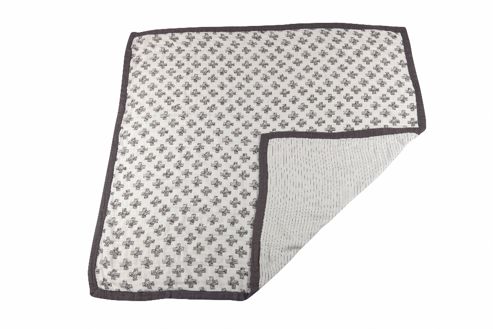 Reversible throw blanket with all-over Nordic cross print and light textured reverse