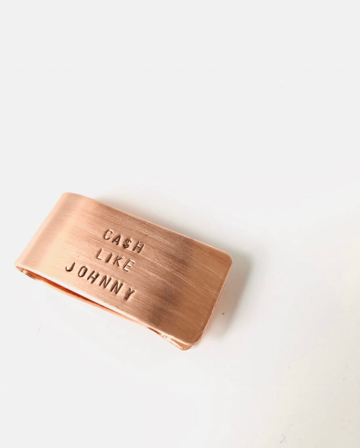 Copper-tone money clip engraved 'CASH LIKE JOHNNY'