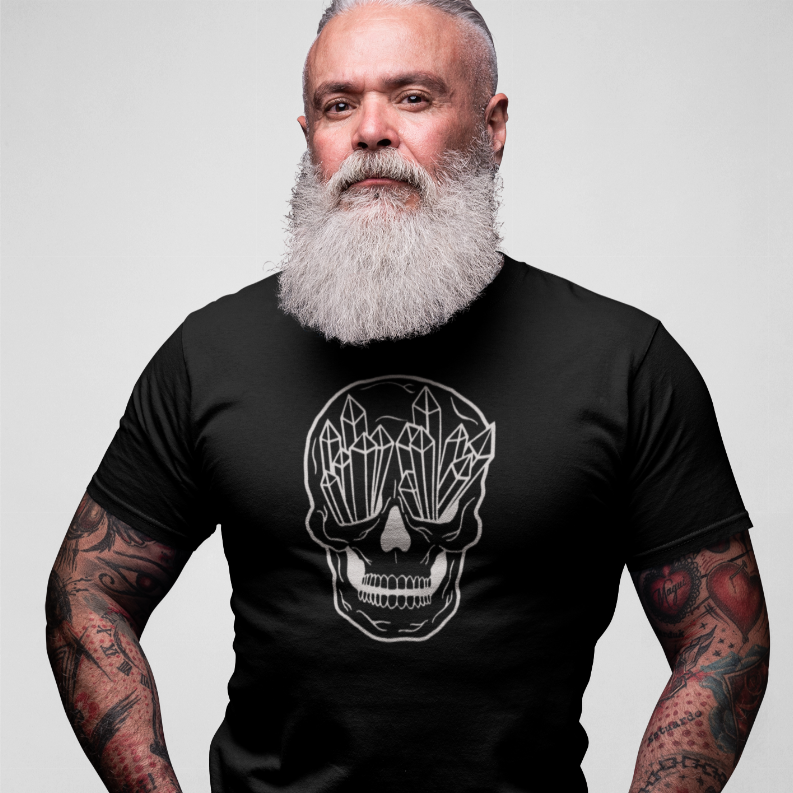 Black crew-neck T-shirt with white geometric skull graphic, chest close-up
