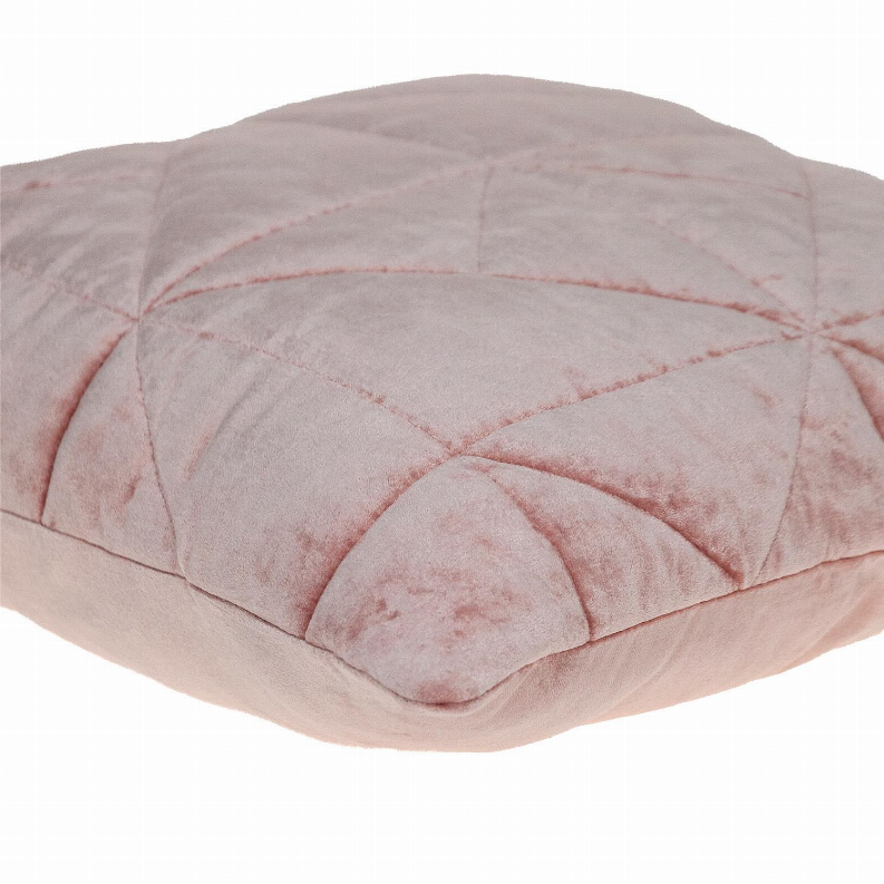 Pink quilted throw pillow top close-up with diamond quilting and channel seams