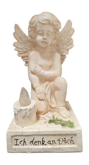 Kneeling angel figurine holding a small solar light lantern on a stone base