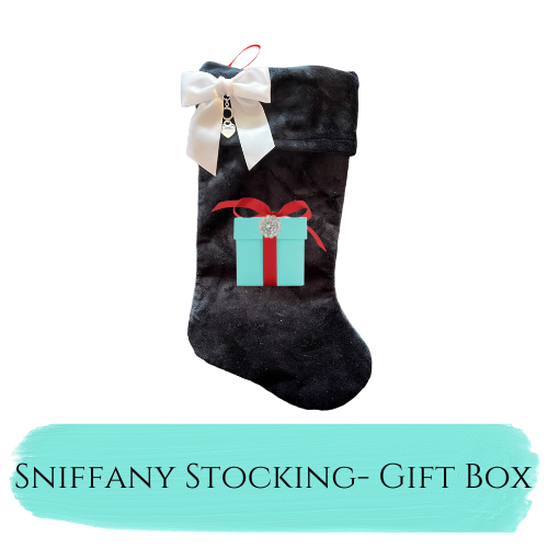 Black faux fur Christmas stocking with gift box applique and bow at top