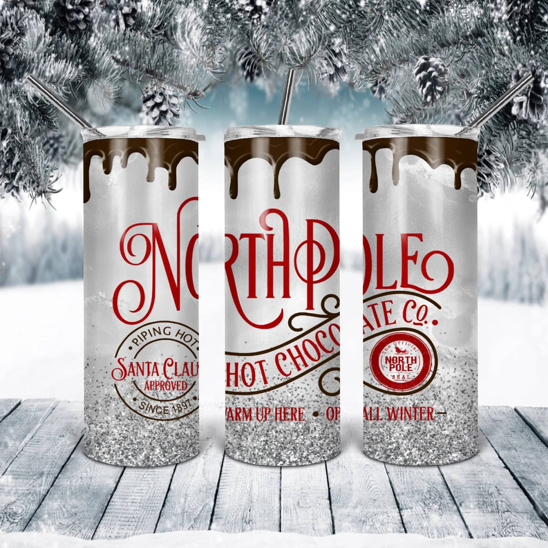 Stainless steel tumbler with red and cream holiday graphic wrap and lid