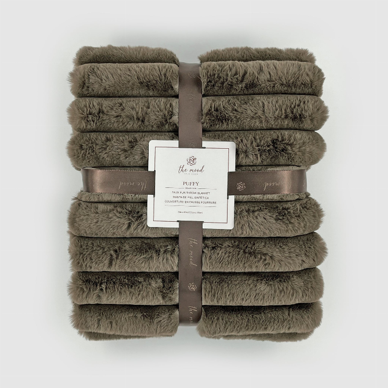 Folded olive faux fur throw blanket stacked and tied with ribbon