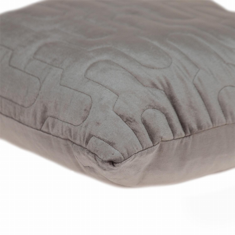 Gray quilted throw pillow corner with raised geometric stitching detail