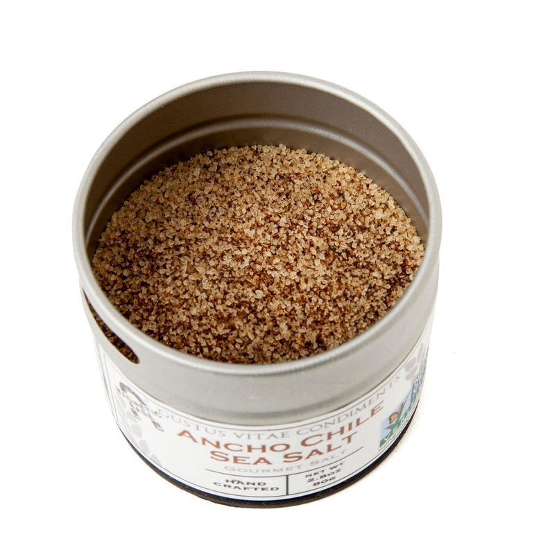 Sea salt tin filled with dark brown seasoning granules