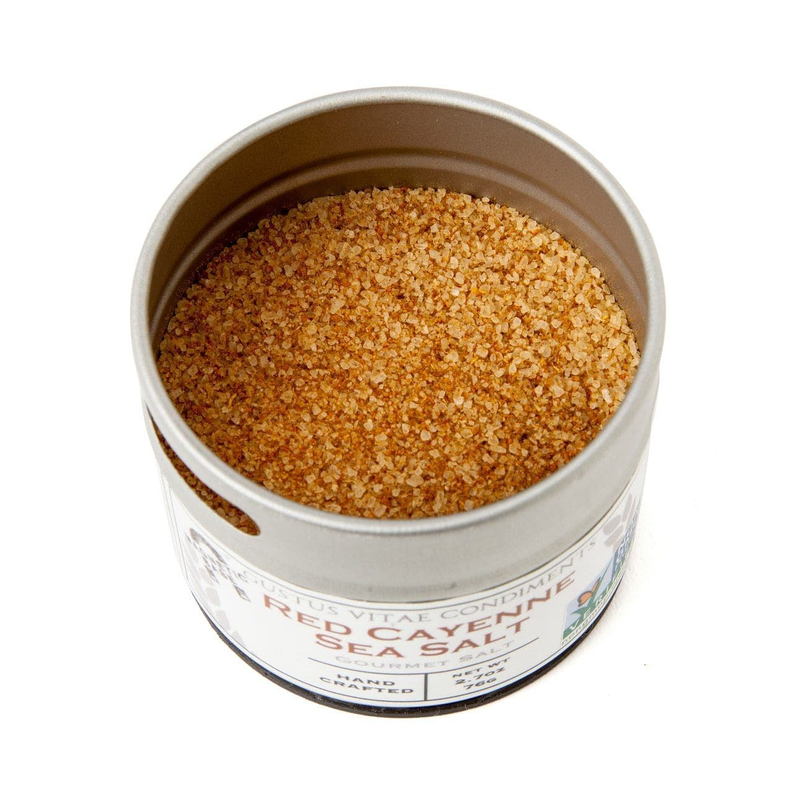 Sea salt tin filled with light tan and golden seasoning crystals