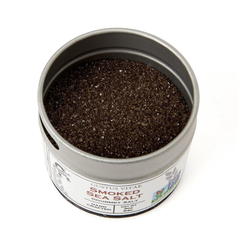 Sea salt tin filled with black peppery seasoning crystals