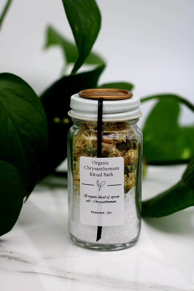 Organic bath salt jar with label text, dried petals in glass, gold seal lid