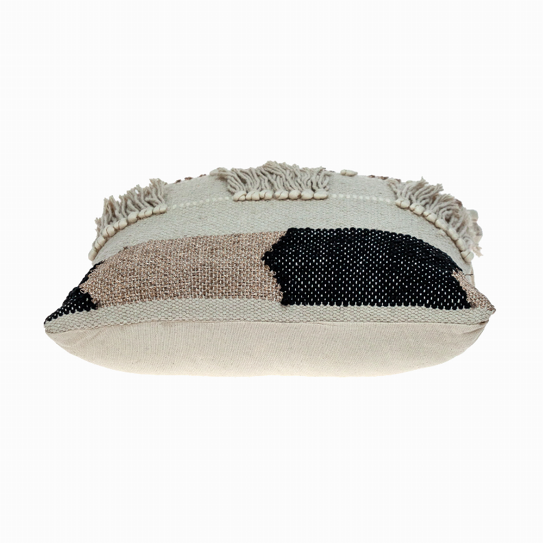 Beige woven throw pillow with black patch and rope-edged corner tassels