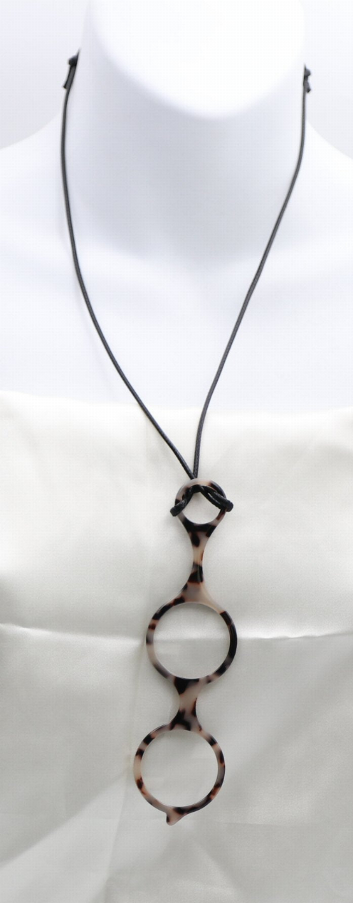 Black reading glasses necklace close-up with round frame pendants and stacked oval links