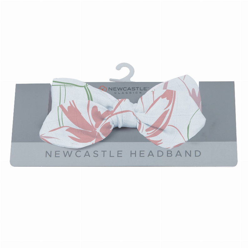 Floral bow headband with pink and green water lily print on light background