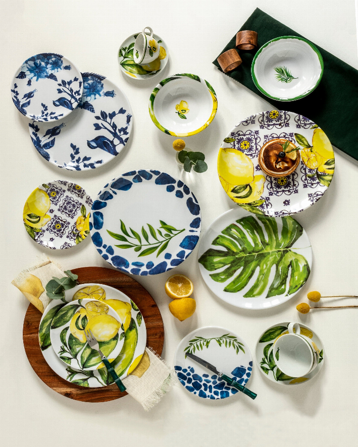Set of four blue and white melamine dessert plates with bird and leaf prints
