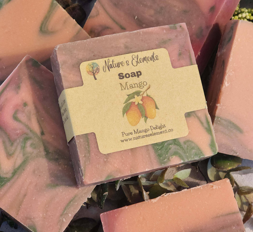 Mango scented handcrafted soap bar with paper label on pink soap