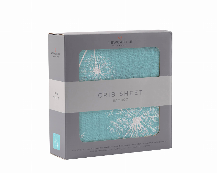 Bamboo crib sheet with teal dandelion seed pattern