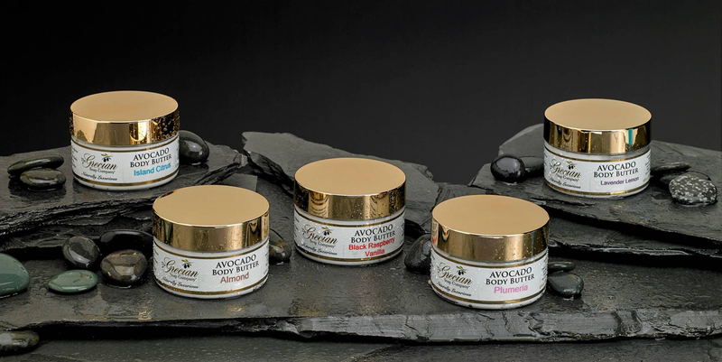Set of avocado body butter jars with gold lids and assorted labels