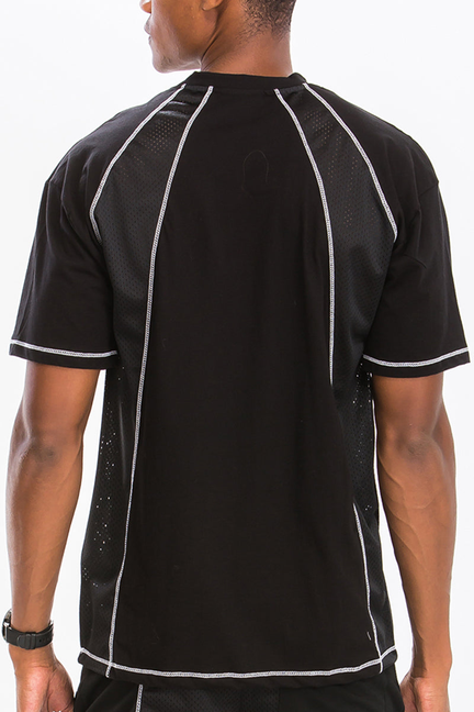 Black mesh stitch shirt back view with white contrast seams and raglan shoulders