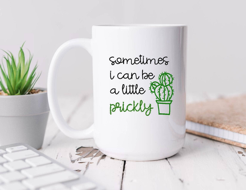 White coffee mug with green cactus and text: “sometimes i can be a little prickly”