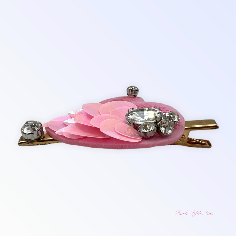 Pink sequin swan hair clip with layered petal flower and four rhinestone studs on gold barrette