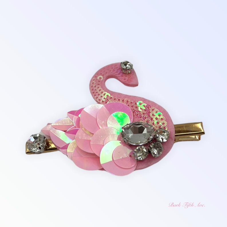Pink sequin swan hair clip with glittery petal layers, rhinestone cluster, and gold barrette