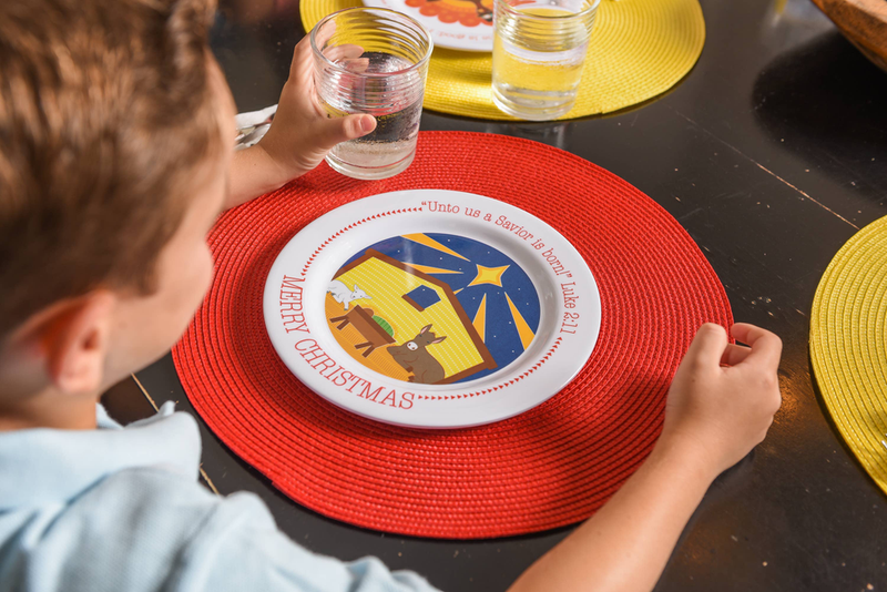 Round white Christmas manger plate with nativity scene and Merry Christmas lettering ring
