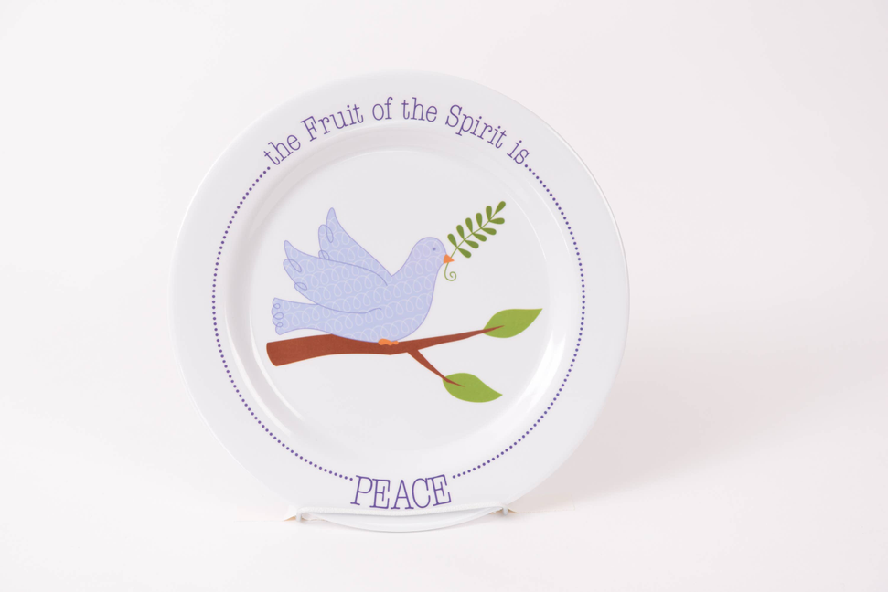 Ceramic peace bowl with dove, green leaves, and "PEACE" lettering on rim