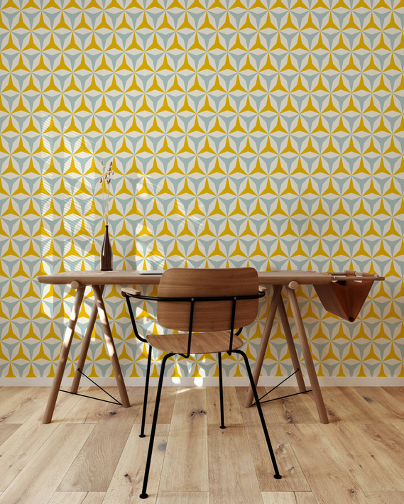 Peel-and-stick vinyl wallpaper with yellow, blue, and white geometric star pattern