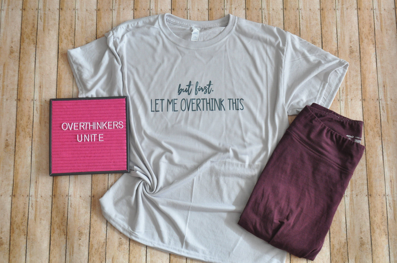 Unisex light gray t-shirt with “but first, let me overthink this” printed front