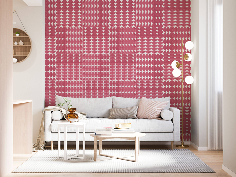 Wallpaper panel covering wall with repeating red and pink geometric circle pattern