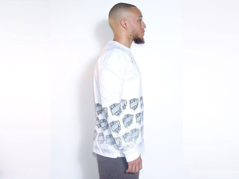 White long sleeve T-shirt with faded blue sleeve and chest graphic print, side view