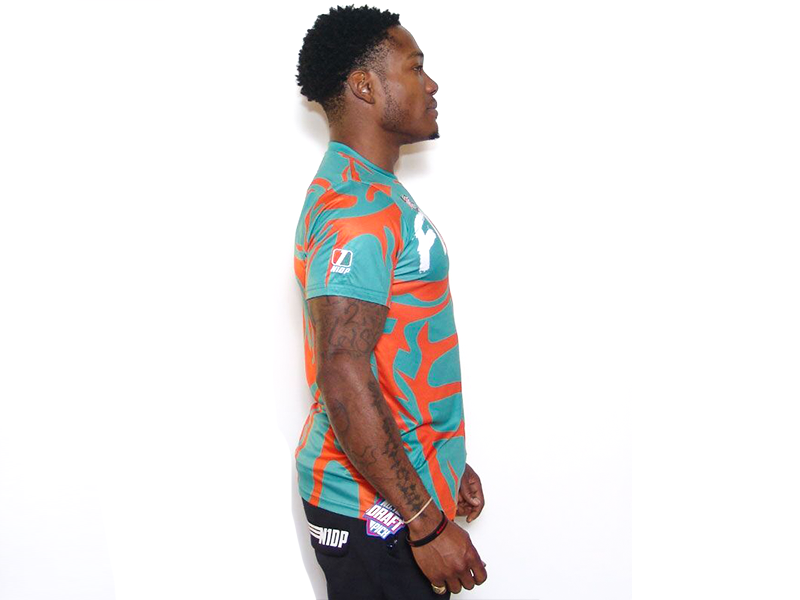 Men's teal T-shirt with orange abstract pattern, crew neck, short sleeves (side)