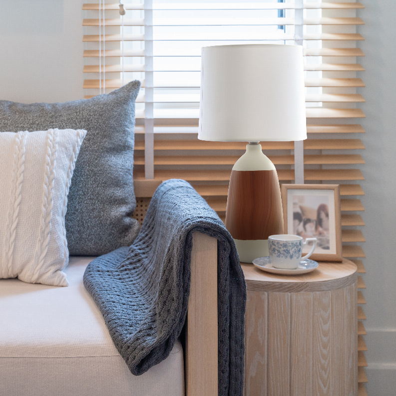 Ceramic oblong table lamp with white drum shade and woodgrain ceramic base