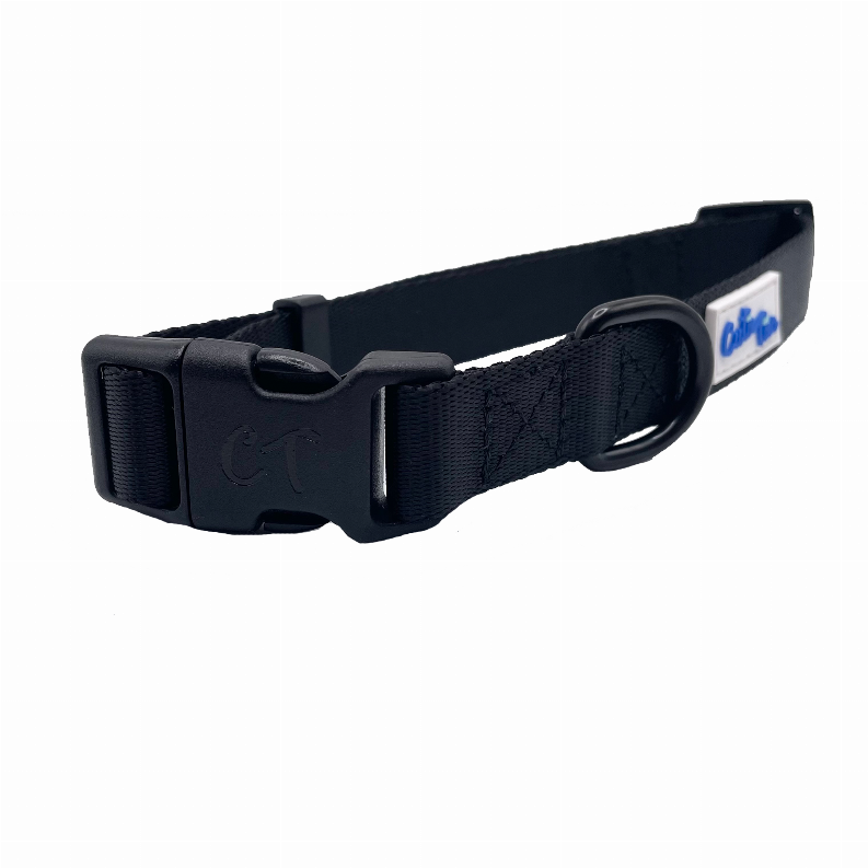Navy dog collar with textured strap, metal buckle ring, and logo patch