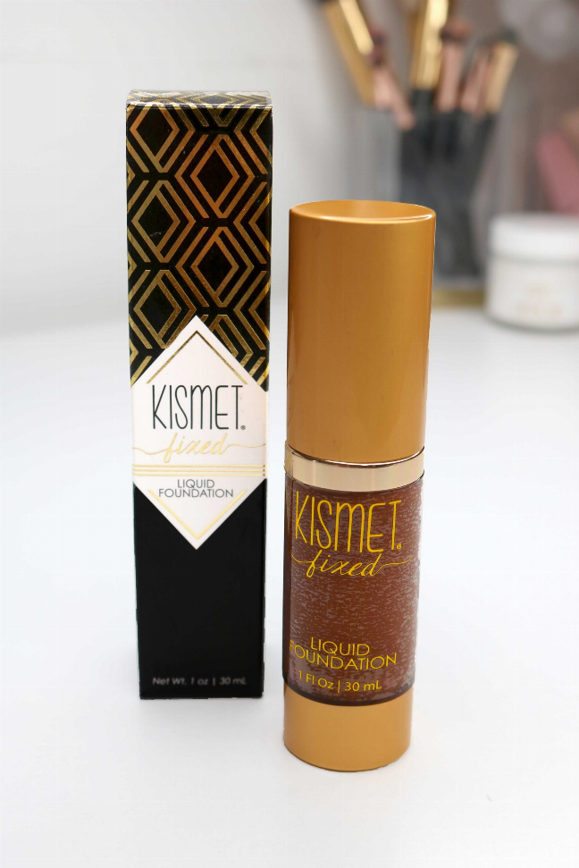 Liquid foundation bottle with gold cap and matching product box