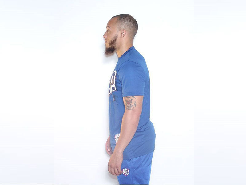 Blue sports t-shirt, crew neck and short sleeves, side view with chest logo.