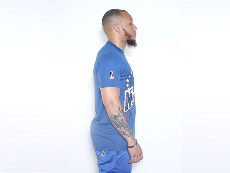 Blue sports t-shirt, crew neck and short sleeves, side view with sleeve graphic.