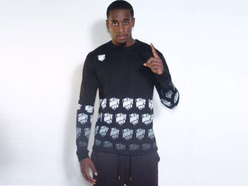 Black long sleeve crewneck T-shirt with white logo pattern on front and sleeves