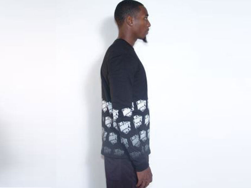 Black long sleeve crewneck T-shirt with white logo pattern panel, side view