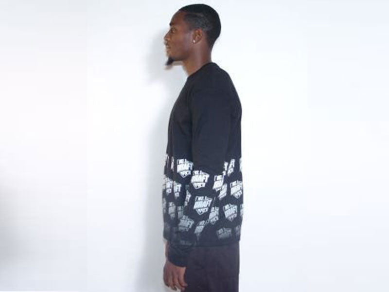 Black long sleeve crewneck T-shirt with white logo pattern, profile view