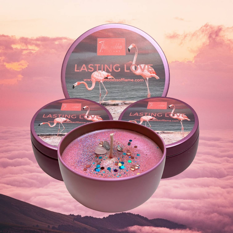Pink candle jar with glittery wax and flamingo wick, shown among three tins