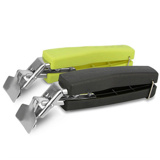 Hot pot picker with cool-touch black base and lime top, metal clamp arms